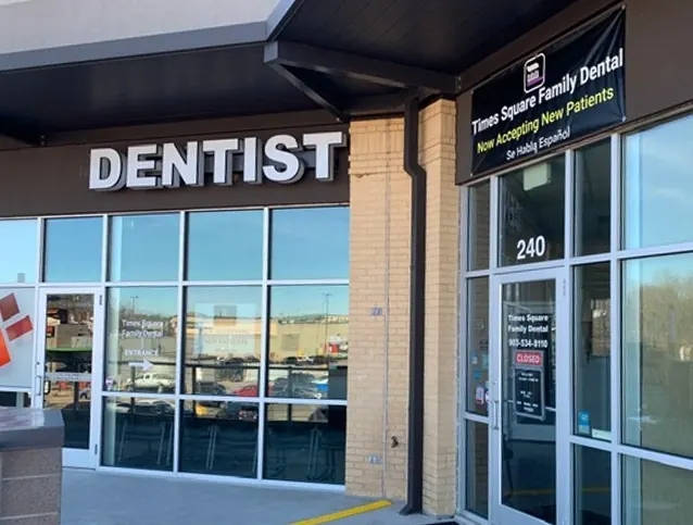 The storefront of Times Square Family Dental, Suite 240, with DENTIST lettering above the door.