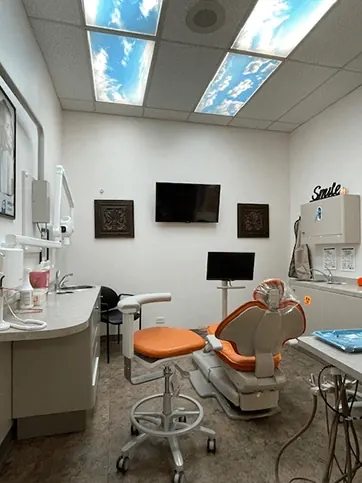 A treatment room at Times Square Family Dental with sky-panel ceiling lights.